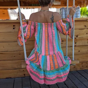 Bohemian off-shoulder vacation mini dress with vibrant geometric patterns and flared sleeves