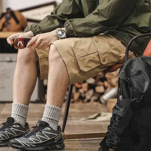 Men's khaki cotton cargo shorts in a slim straight fit, perfect for outdoor summer wear
