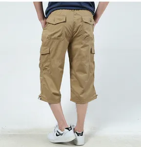 Detailed back view of khaki multi-pocket cargo capris for men in casual outdoor style