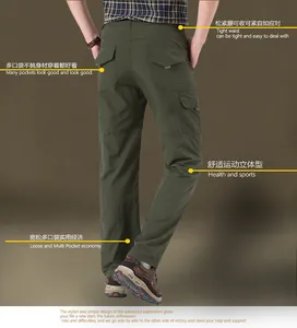 Dettaglio dei pantaloni cargo verde oliva con multitasche e vita elastica