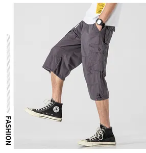 Men's loose cargo cropped pants in dark grey featuring multi-pocket design