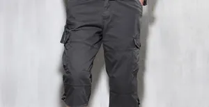 Detailed view of men's loose dark grey multi-pocket cargo shorts for outdoor summer leisure.