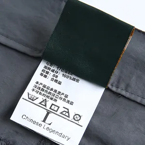 Close-up of the wash label on men's quick-dry hiking pants showing fabric composition