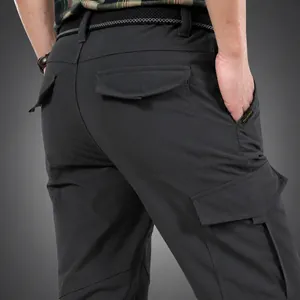 Men's winter outdoor climbing cargo pants with warm fleece lining and multi-pockets