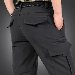 Men's winter outdoor climbing cargo pants with warm fleece lining and multi-pockets