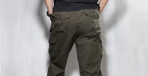 Detailed back view of men's loose olive green cargo shorts featuring flap pockets