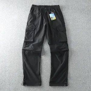 Detailed flat lay of men's black convertible cargo pants featuring multiple pockets.