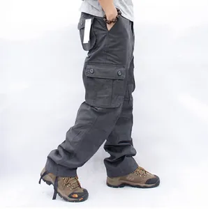 Side view detail of dark grey multi-pocket cargo pants for men's outdoor activities