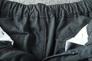 Detailed close-up view of the elastic waistband and inner lining of men's cargo pants