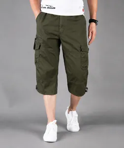 Detail shot of men's loose fit army green cargo shorts made of pure cotton fabric