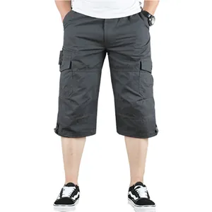 Front detailed view of men's loose fit dark gray cotton cargo 3/4 length shorts