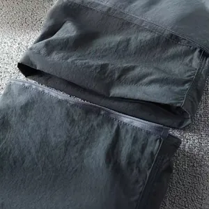 Detail of men's lightweight convertible cargo pants with detachable zipper legs