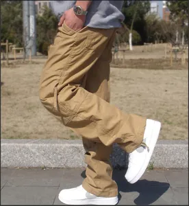 Detail of khaki multi-pocket cargo pants showing durable fabric and straight leg fit