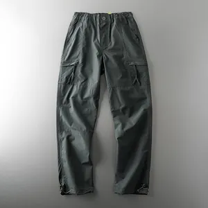 Dark grey outdoor tactical cargo pants with multiple pockets and adjustable cuffs