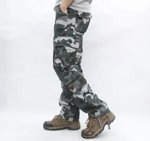 Close-up detail of grey camouflage cargo pants featuring multi-pocket utility design
