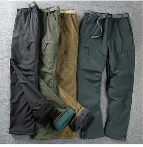 Detailed view of winter men's fleece-lined softshell outdoor pants in multiple colors