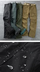 Detail view of waterproof softshell pants showing color options and water-repellent fabric