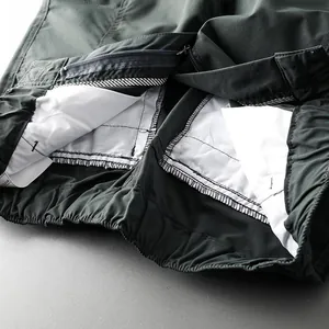 Detail of inner waist and pocket lining of men's outdoor waterproof tactical pants