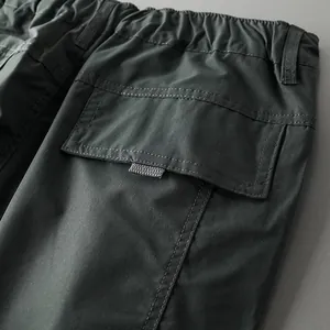 Close-up detail of waterproof outdoor tactical pants pocket and durable fabric texture
