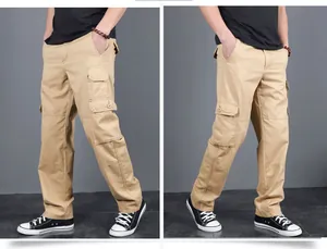 Detailed side view of khaki multi-pocket cargo pants showing loose fit and fabric texture