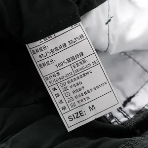 Detail of material care label on outdoor tactical pants showing fabric composition