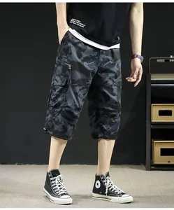 Men's camouflage cargo shorts featuring casual three-quarter length and loose fit design