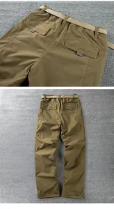 Back view and pocket detail of men's windproof winter outdoor softshell pants with belt