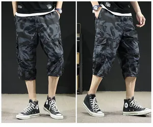 Close-up detail of camouflage pattern and side pockets on men's relaxed fit summer cargo pants