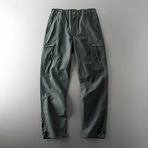 Men's dark grey waterproof tactical cargo pants for hiking and outdoor activities