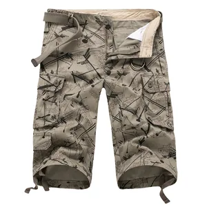 Close-up of men's cargo cropped pants with graffiti print and woven belt