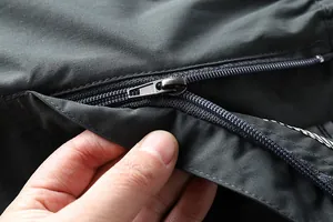 Macro view showing the durable zipper pocket of men's outdoor quick-dry hiking pants