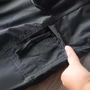 Detail of zipper pocket on black outdoor waterproof quick-dry tactical pants for men