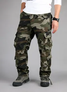Detail view of men's loose-fit green camouflage cargo pants with multiple pockets