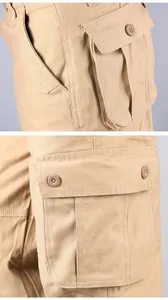 Détail gros plan des poches de pantalon cargo kaki avec fermeture à bouton et couture