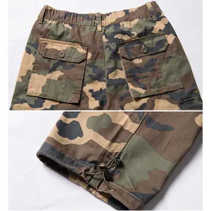 Close-up of camouflage cargo pants showing flap pockets and adjustable drawstring cuffs