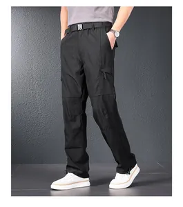Close-up showing the straight-leg fit and fabric texture of men's black tactical cargo pants.