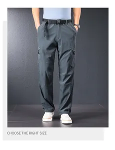 Detail view of men's grey lightweight outdoor cargo pants with side pockets and belt