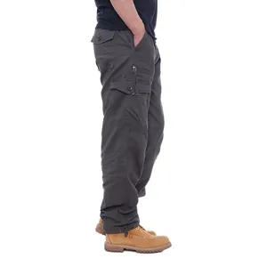 Side view of men's dark gray cotton cargo pants with multiple functional pockets.