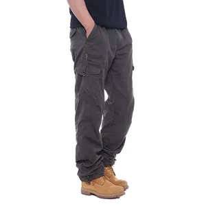 Detailed side view of men's loose cotton cargo pants featuring multiple utility pockets