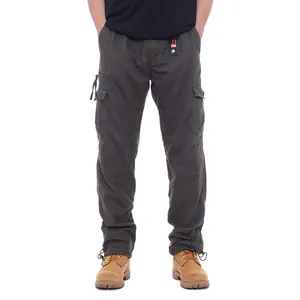 Detail of charcoal grey cotton cargo pants with multiple pockets and elastic waist