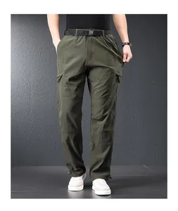 Detail view of men's quick-dry outdoor cargo pants in olive green, featuring a tactical belt