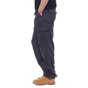 Side view detail of men's dark grey cotton cargo pants with multi-pockets