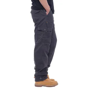 Side view of durable men's dark grey cotton cargo pants with multiple utility pockets