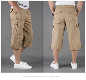 Detailed view of khaki cargo capri pants with multi-pocket design for men.