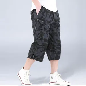 Side view of men's camouflage cargo shorts with multiple functional pockets and drawstring