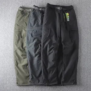 Detailed view of men's multi-pocket cargo pants in green, grey, and black colors