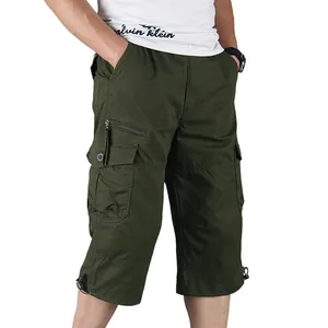 Loose fit men's dark green cargo shorts with multiple pockets for outdoor leisure