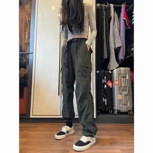 Full view of women's olive green techwear cargo pants with pockets and adjustable belt