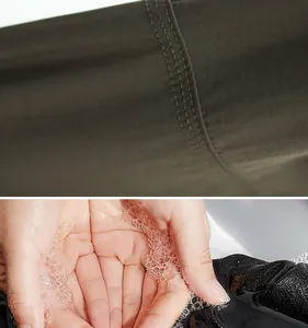Detaillierte Makroansicht der Nähte von Outdoor-Hosen und Handwasch-Demonstration