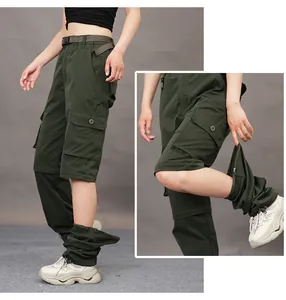 Detail view of detachable green cargo pants with zipper feature for outdoor hiking adventures
